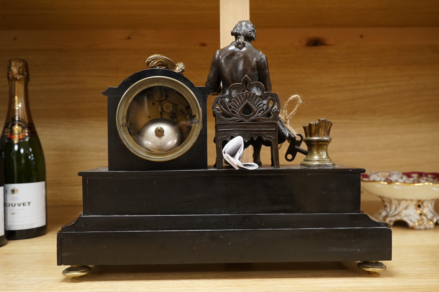 A 19th century French bronze and slate 8 day mantel clock, mounted with figure of Denis Diderot (1713-1784), 40cm wide